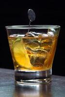 Old Fashioned, drink with sugar, whiskey, sparkling water and angostura photo