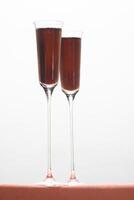 Kir Royale, sophisticated drink with cassis liqueur, champagne and red fruits photo