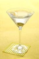 Vodka Martini, drink with vodka, dry martini and an olive in the glass photo