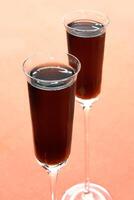 Kir Royale, sophisticated drink with cassis liqueur, champagne and red fruits photo