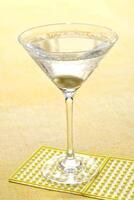 Vodka Martini, drink with vodka, dry martini and an olive in the glass photo