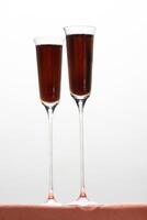 Kir Royale, sophisticated drink with cassis liqueur, champagne and red fruits photo