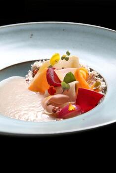 cold cocoa soup with pickles, honey and cocoa nibs photo