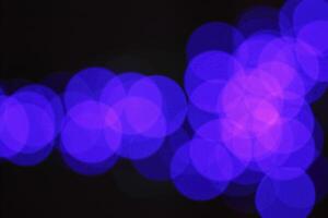 colorful and defocused lights on black background photo