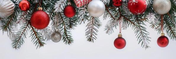 A Christmas tree with many red and silver ornaments hanging from it photo