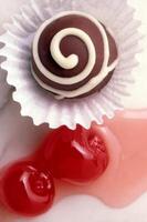 chocolate candies with maraschino cherries photo