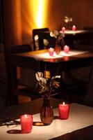 sophisticated party decoration with candles, flowers, tables and specialized lighting photo