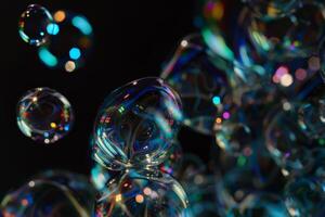 A bunch of bubbles in the air with a dark background photo