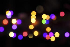 colorful and defocused lights on black background photo