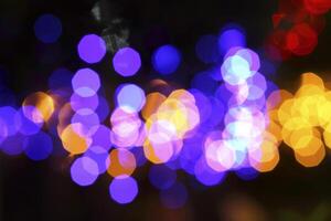 colorful and defocused lights on black background photo