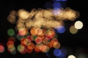 colorful and defocused lights on black background photo