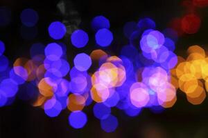 colorful and defocused lights on black background photo