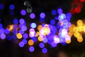 colorful and defocused lights on black background photo