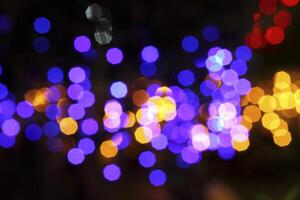 colorful and defocused lights on black background photo