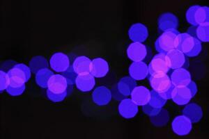 colorful and defocused lights on black background photo