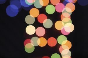 colorful and defocused lights on black background photo