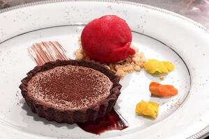 chocolate tartlet with strawberry ice cream photo