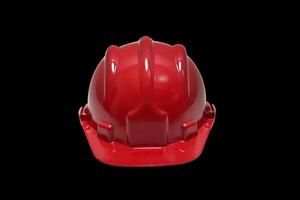 red plastic work helmet on black background photo