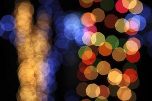 colorful and defocused lights on black background photo