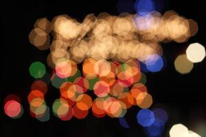 colorful and defocused lights on black background photo