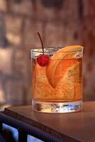 Old Fashioned, classic drink with whiskey, sparkling water, sugar and angustura photo