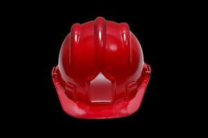 red plastic work helmet on black background photo