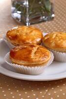 baked shrimp pies on the table photo