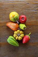 wooden decorative fruits on the table photo