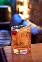 Old Fashioned, classic drink with whiskey, sparkling water, sugar and angustura photo