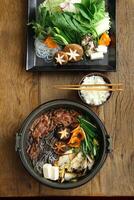 Sukiyaki, classic Japanese cuisine on a plate photo