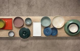 assembly with plates, dishes, pans and ceramic bowls seen from above photo