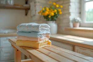 Meticulously Arranged Pile of Freshly Washed Towels in Cozy Laundry Room photo