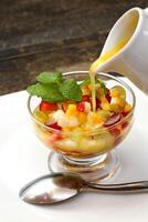 fruit salad with orange juice photo