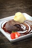 petit gateau with cream ice cream on plate photo