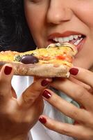 smiling brunette model with her piece of pizza photo
