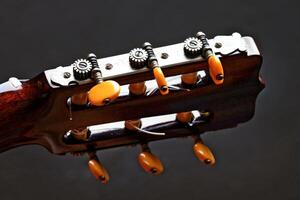 six string guitar close up on black background photo