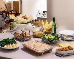 table complete with Brazilian Sunday lunch photo