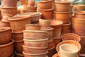 clay flower pots on shop photo