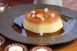 milk pudding with caramel sauce and whipped cream photo