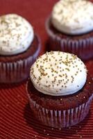 red velvet cupcake with cream frosting photo