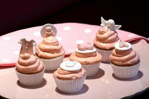 cupcakes with pink decoration and elements for girls' parties photo