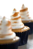 delicious cupcake with dulce de leche filling and whipped cream topping with caramel photo