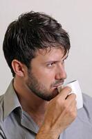 young man with beard in different situations on neutral background photo