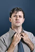 young man with beard in different situations on neutral background photo