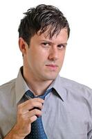 young man with beard in different situations on neutral background photo