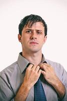 young man with beard in different situations on neutral background photo