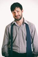 young man with beard in different situations on neutral background photo