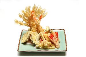 Shrimp and vegetable tempura, typical Japanese dish with breaded and fried shrimp and vegetables photo