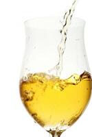 white wine being served in a glass on a white background photo