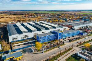 Modern production building. Aerial view of big industrial factory. photo